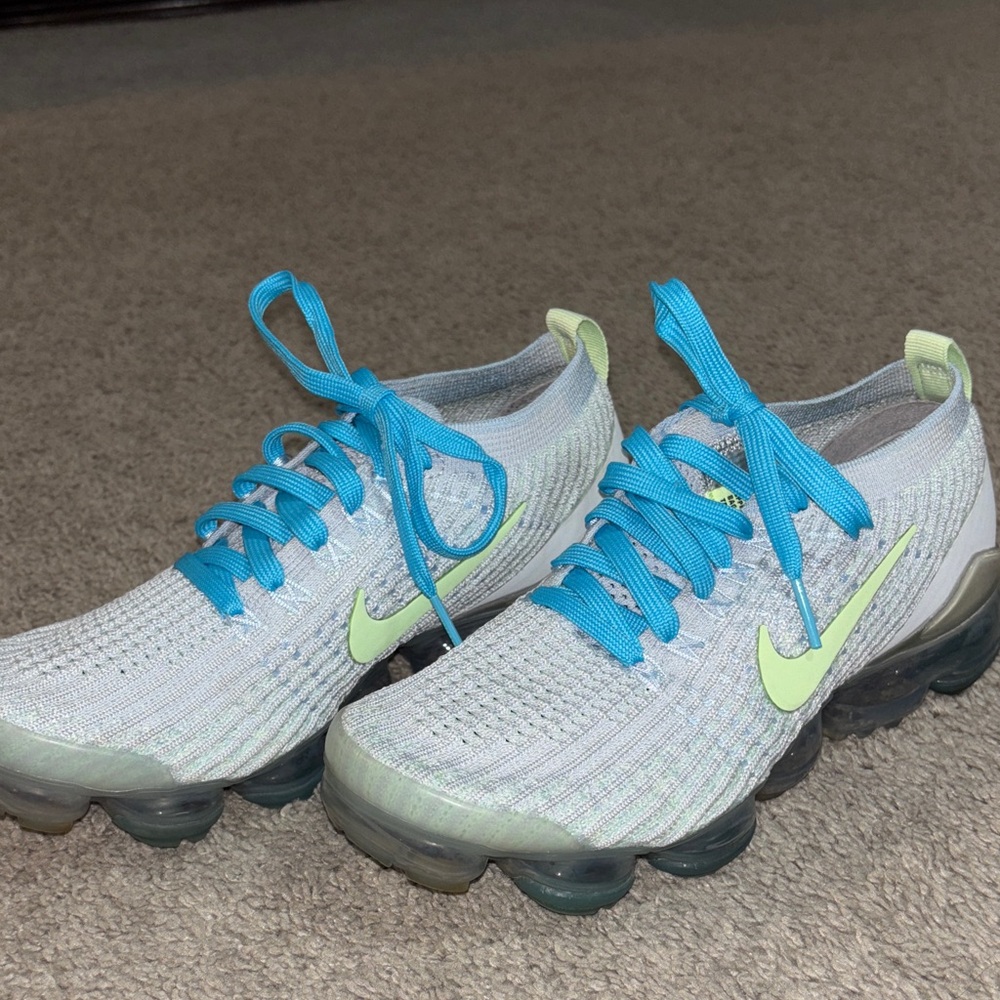 Nike Flyknit Sneakers with Blue and Lime Accents